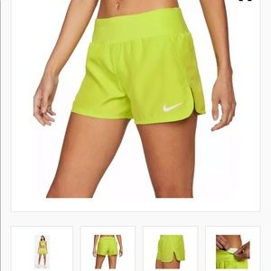 Green Nike running shorts